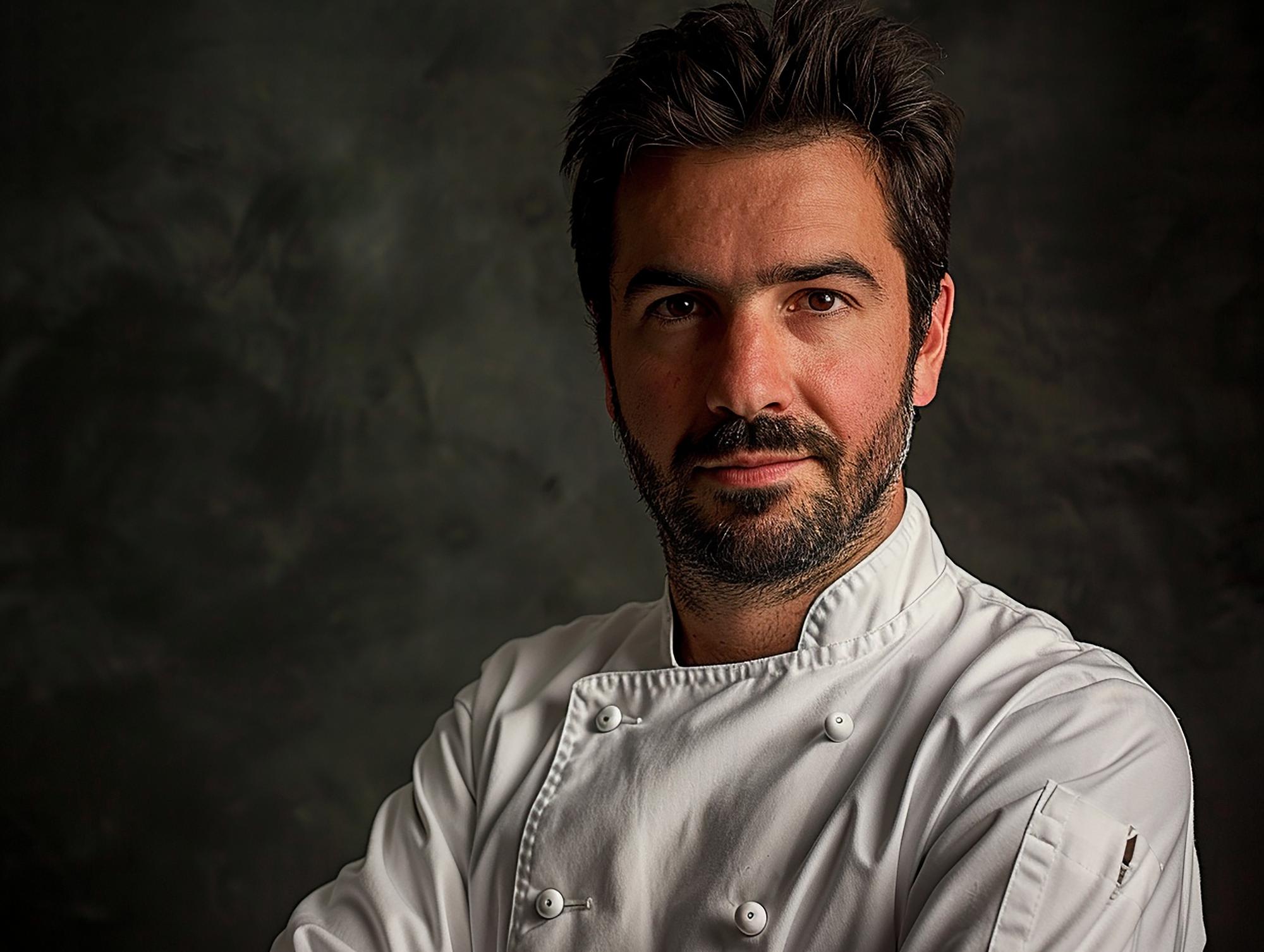 Portrait of head chef in modern kitchen